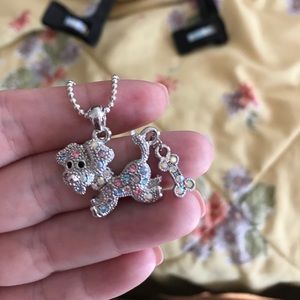 Gem engraved silver dog necklace.