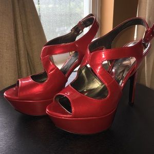 Carlos Santana red pumps
