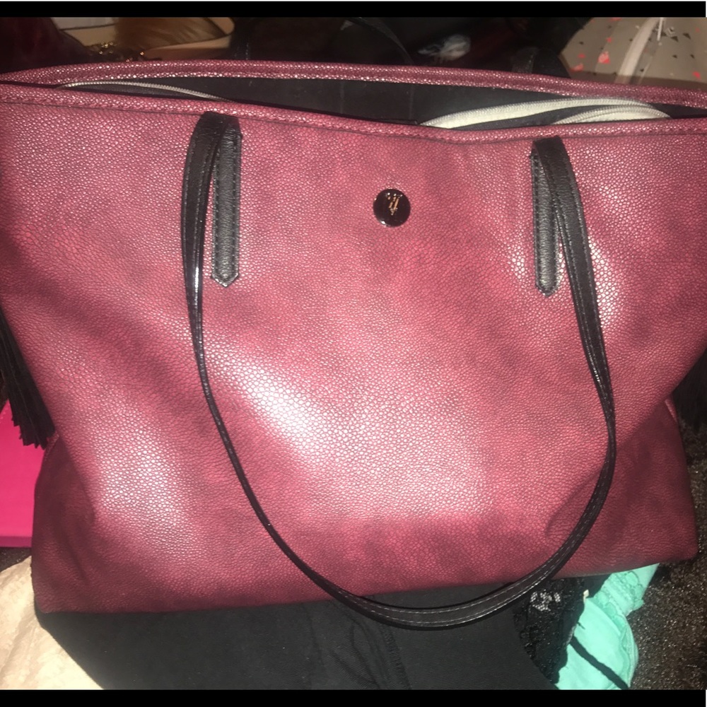 Large burgundy tote with tassels.