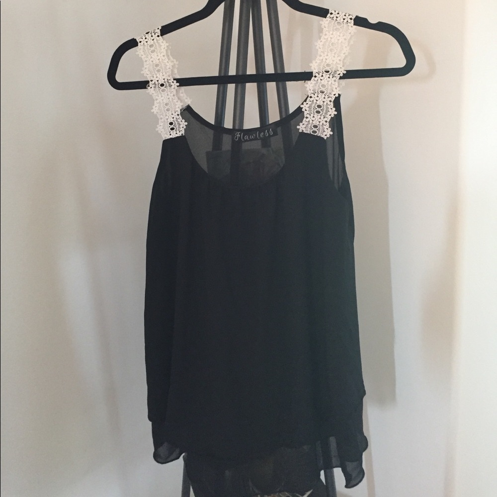 Black camisole with lace straps.