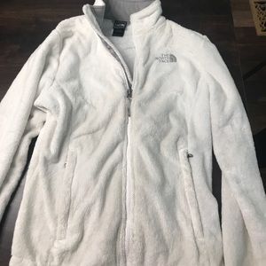White fuzzy North Face jacket