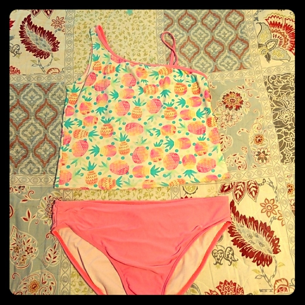 Coral pineapple two piece bathing suit.