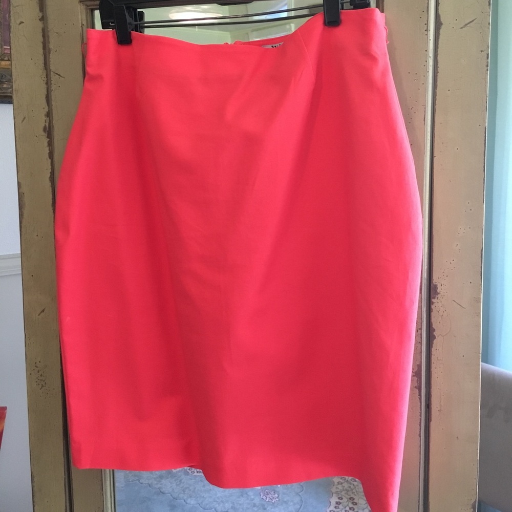 Coral colored skirt.