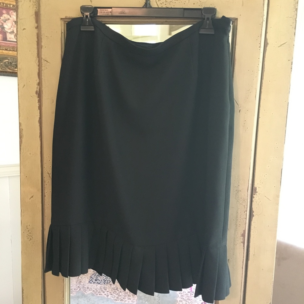 Black skirt with pleated ruffles around bottom.