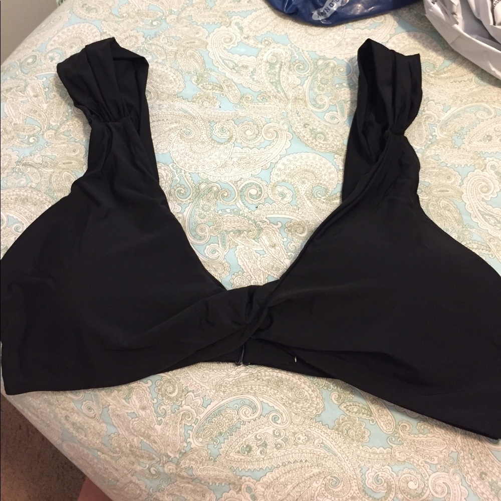 Black bathing suit top, still with tags