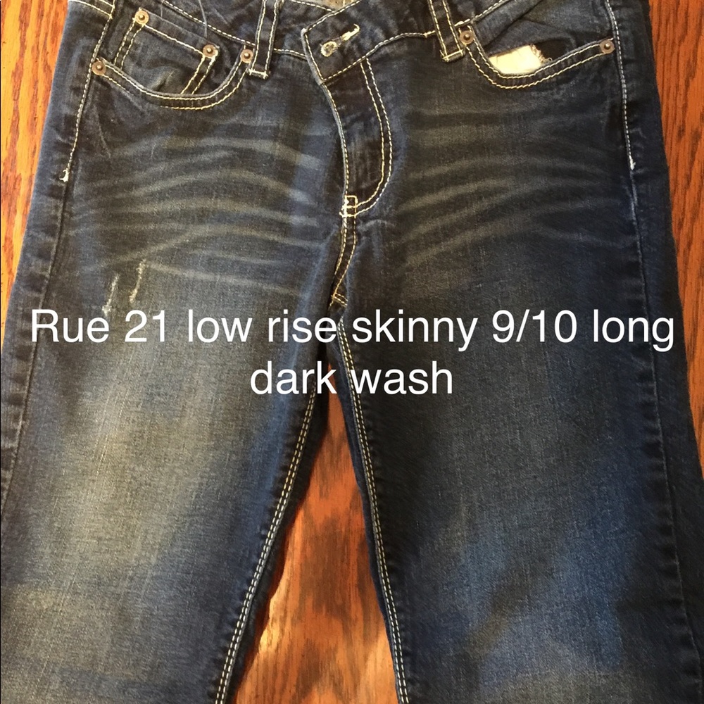 Rue 21 9/10 Long low rise skinny dark wash jeans.