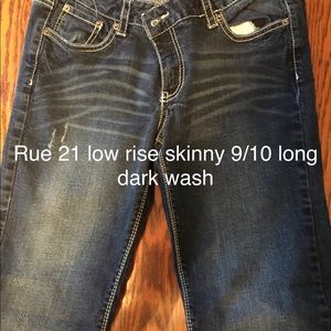 Rue 21 9/10 Long low rise skinny dark wash jeans.