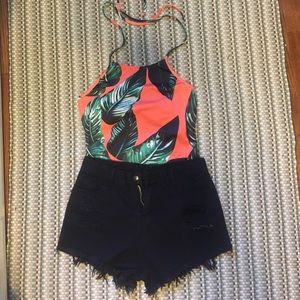 Body suit with frayed black shorts