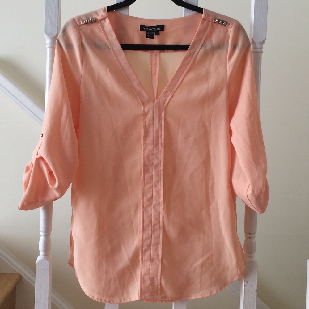 Peach blouse with gold shoulder plackets