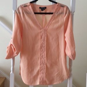 Peach blouse with gold shoulder plackets