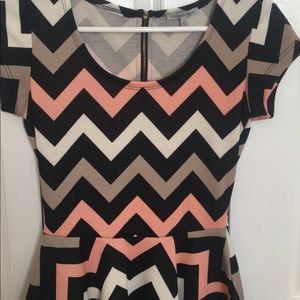 Pink, grey and black chevron peplum top.