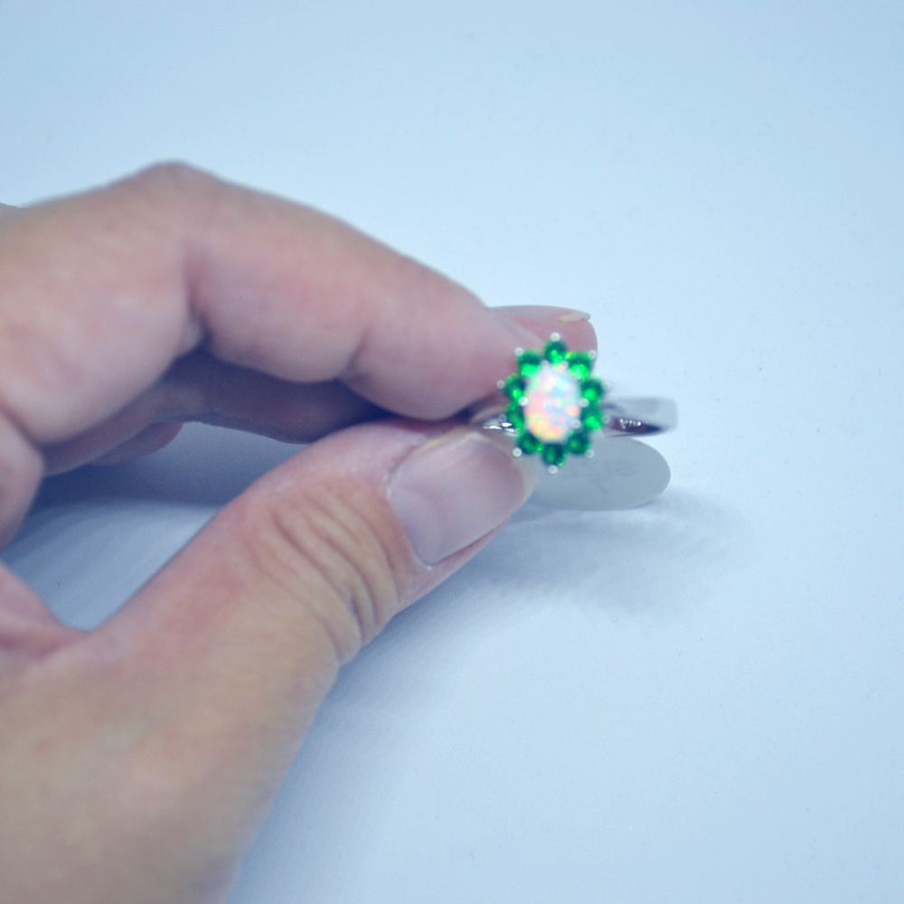 Iab-created opal with genuine green sapphire ring