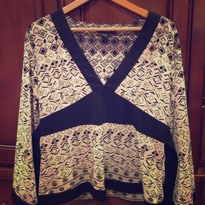 Ninety blouse. Large cuffs. Empire waist.