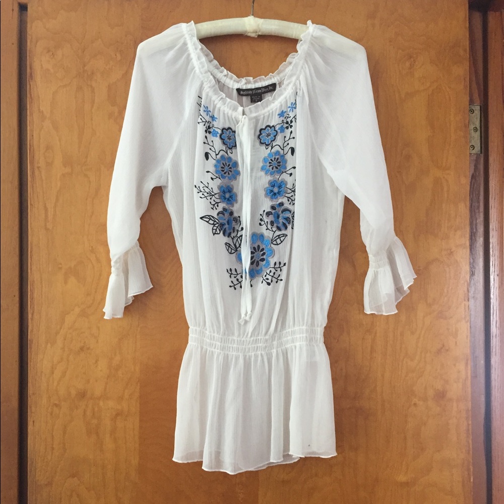 White blouse, blue flowers