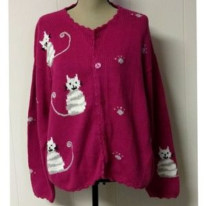 Rey wear pink cardigan with cats