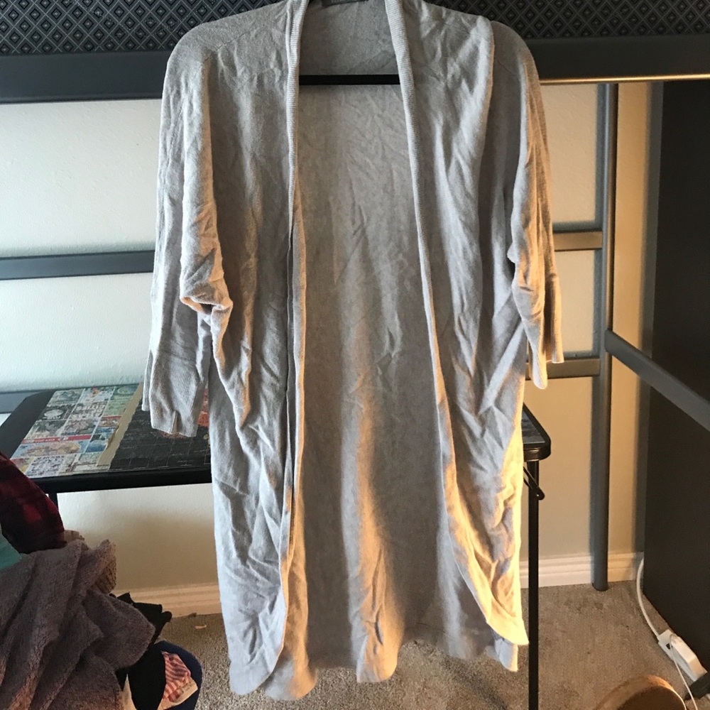 Long grey cardigan, quarter length sleeves.