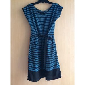 Green and black striped dress with a ribbon.