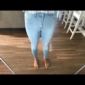 Distressed light blue skinny jeans