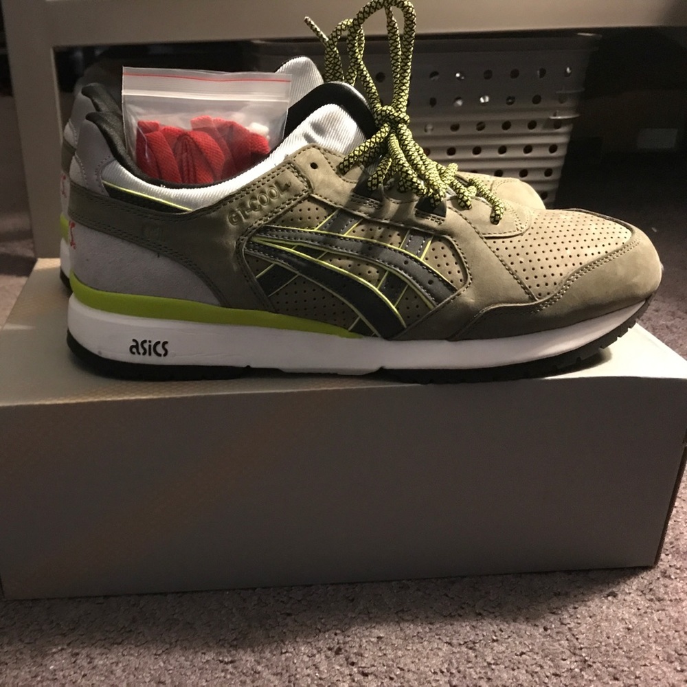 Asics with some red and white laces.