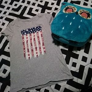 A tee shirt that's has the American flag on it shi