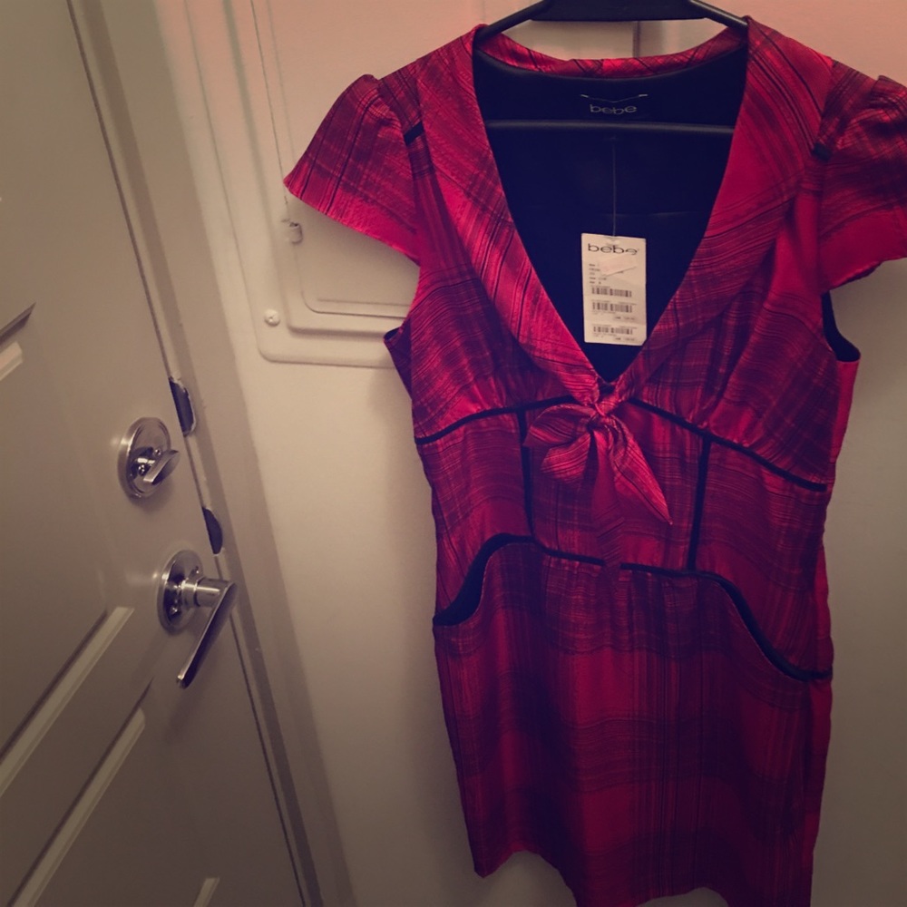 Beautiful dress from BEBE very flattering.