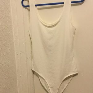A basic white bodysuit.