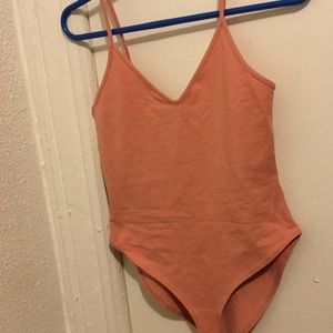 A light rose bodysuit