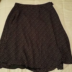 A-line skirt.  black with bright pink flowers