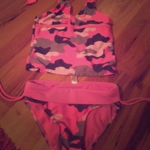Camouflaged pink swim suit.