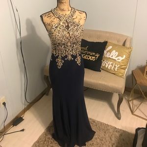 Flattering navy blue gown with gold accents