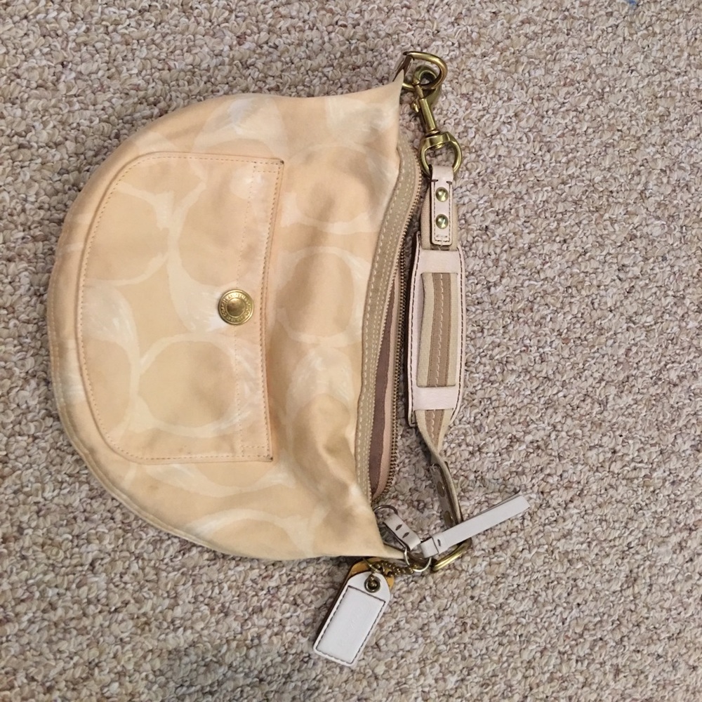 Coach purse (gently used).  Gold white and yellow.