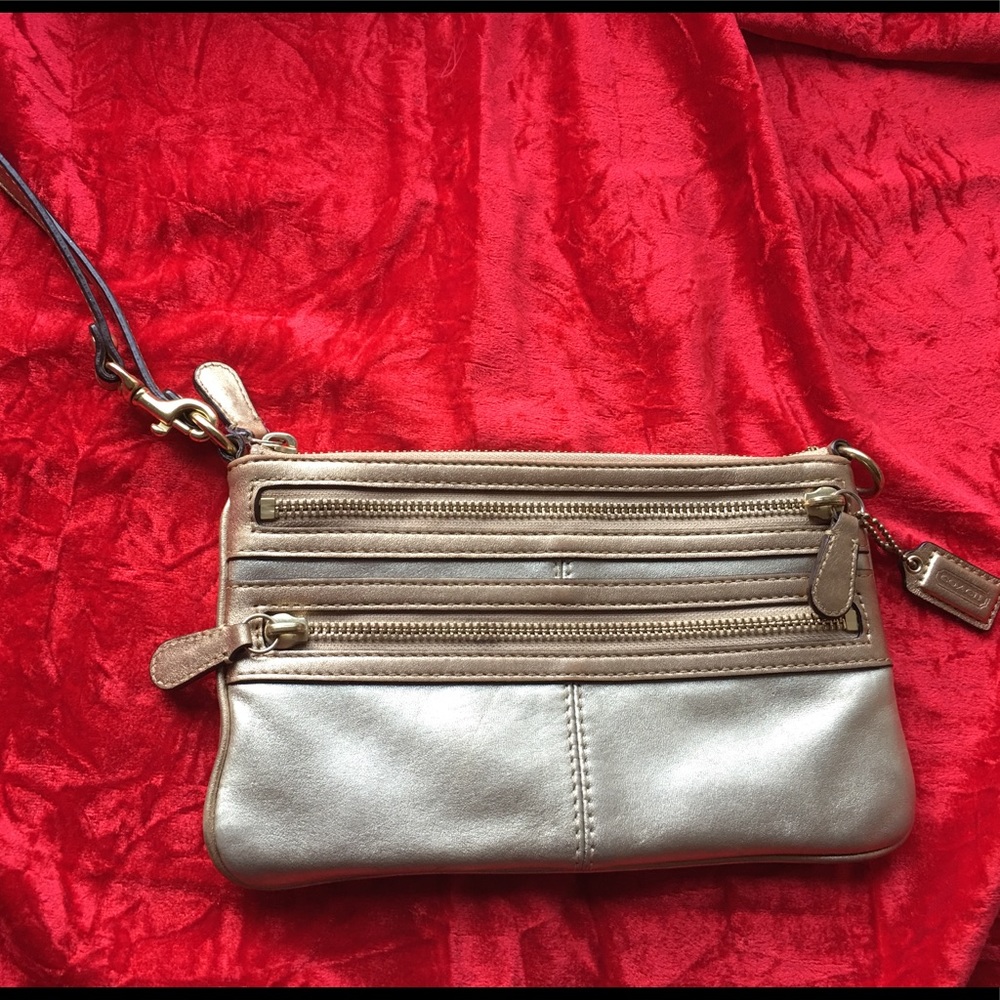 Coach, gold metallic wristlet/clutch