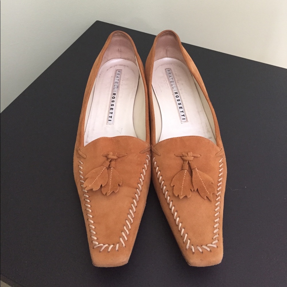 A pair of butterscotch tasseled loafers