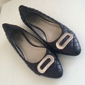 Black flat shoes .