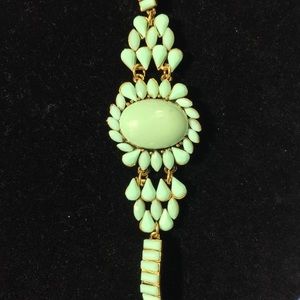 Light green color bracelet with gold accent