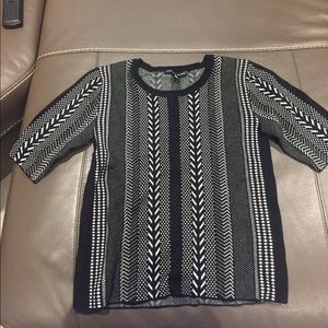 Black and white knit shirt.