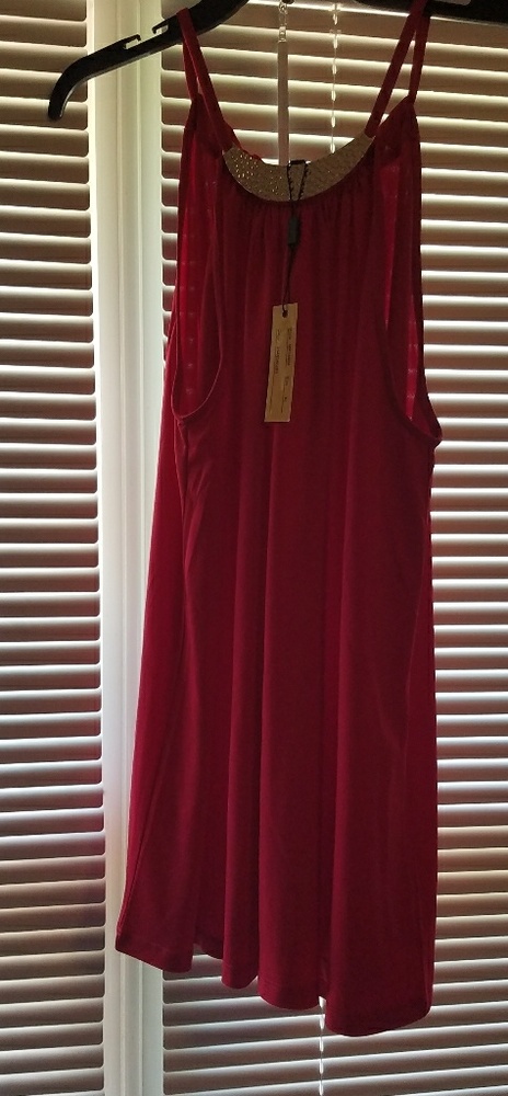 Long shirt with metal embellishment at collar