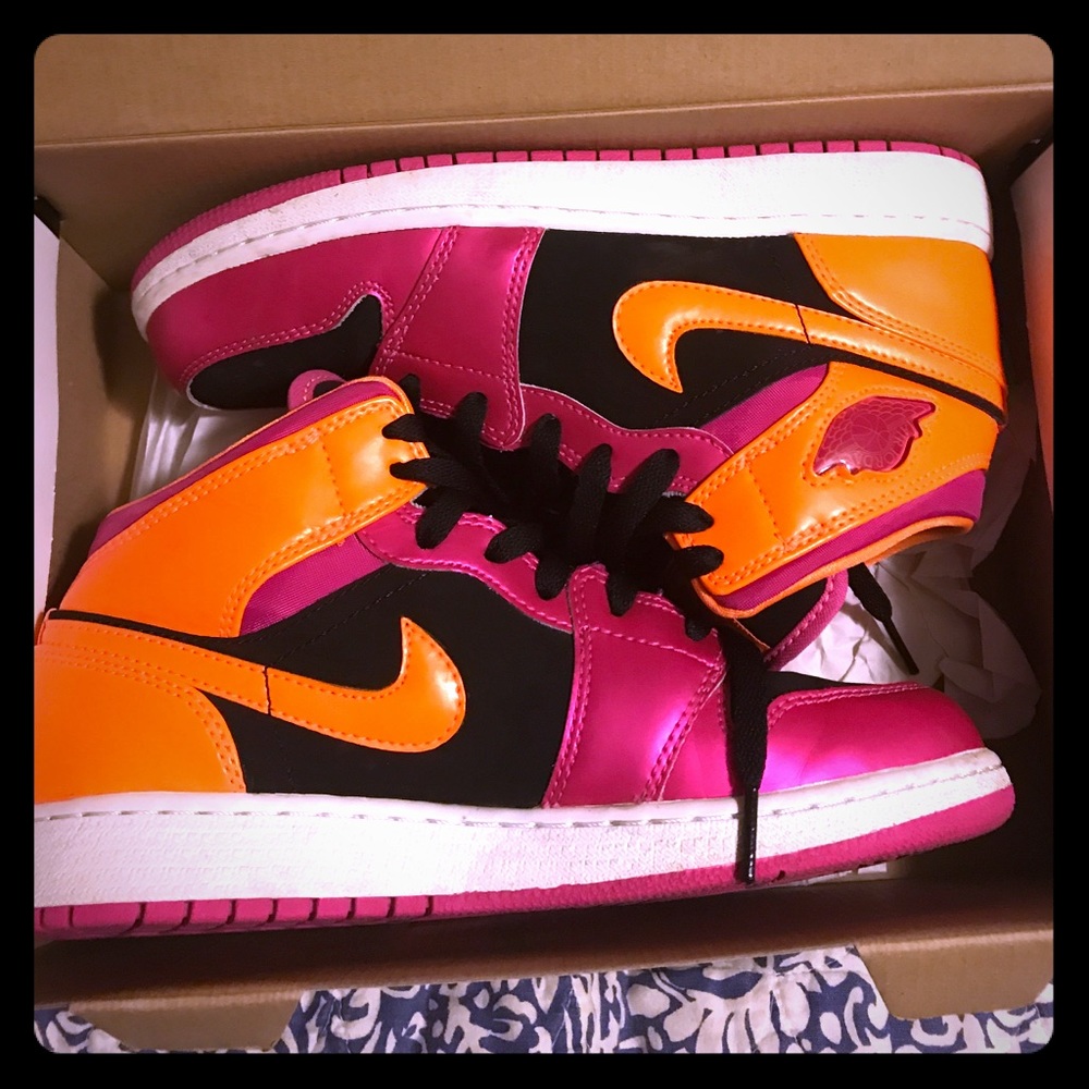 Neon orange and pink girls Air Jordan 1s