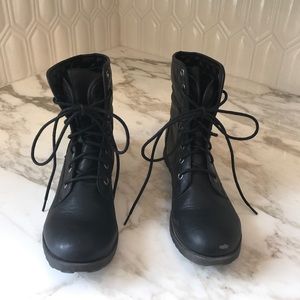 Black lace-up military style boots.
