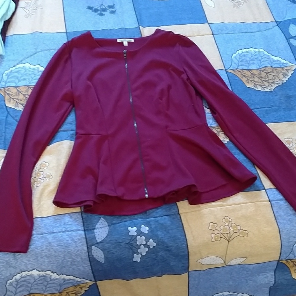 It can be worn as a shirt or it can be a blazer