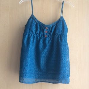 Green lace top with three wooden buttons.