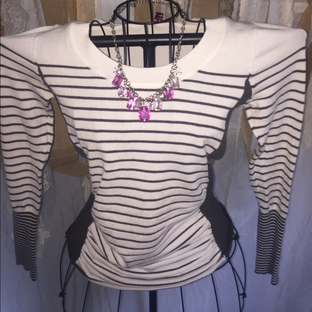 Fun & flirty classic sweater with a twist