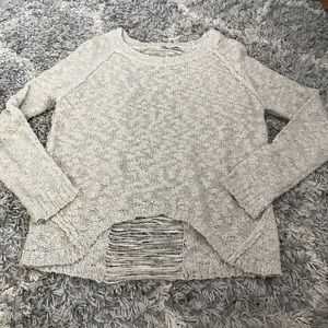 Knit sweater with distressed back