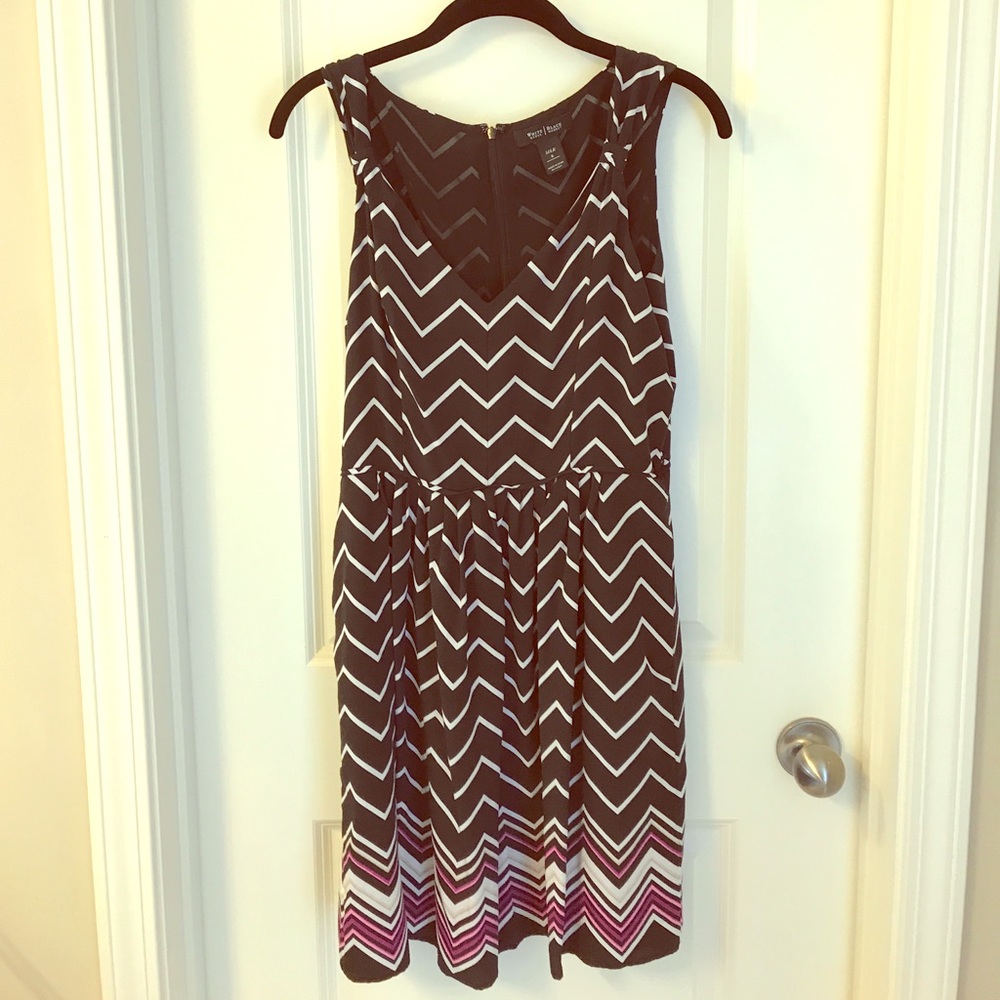 Sleeveless black, white, and purple dress.