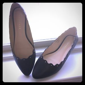 Black scalloped flats with gold studs