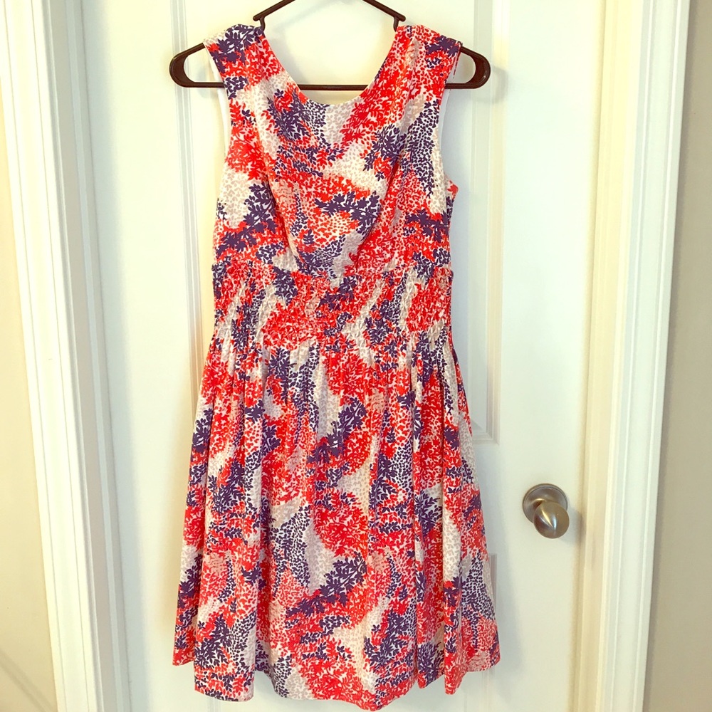 Orange, blue, and brown flowered dress.