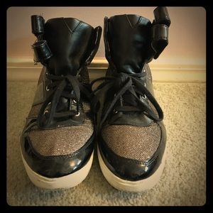 Black and gold high top sneakers