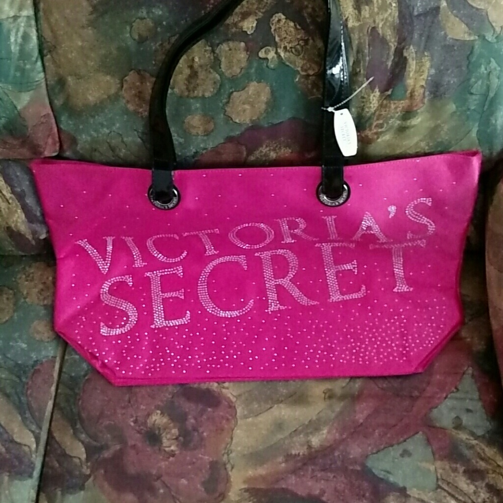 Pink satin tote with black vinyl handles