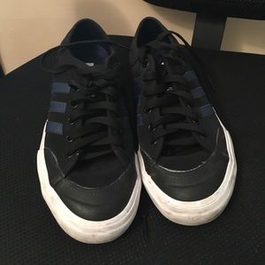Black and blue adidas matchcourt