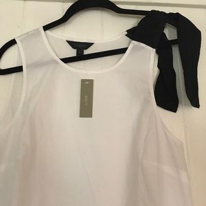 White tank with black bow on one side
